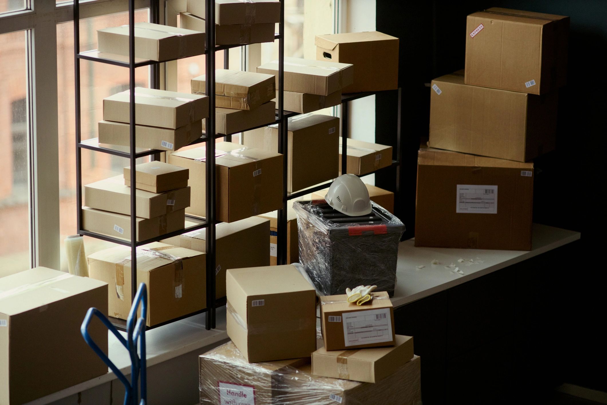 Warehouse shelves with packed shipping boxes